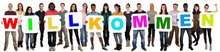 People with welcome sign. Picture: Markus Mainka/Fotolia.com