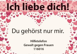 Viele rote Herzen, in schwarz darauf der Schriftzug „Ich liebe Dich!“. In einem großen weißen Herz in der Mitte steht „Du gehörst nur mir. Hilfetelefon Gewalt gegen Frauen 116016“. Foto: Stadt Oldenburg